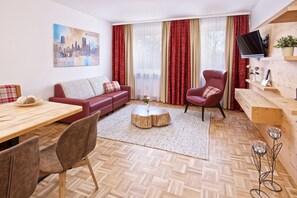 Grand Apartment | Living area | 26-inch LCD TV with satellite channels, TV