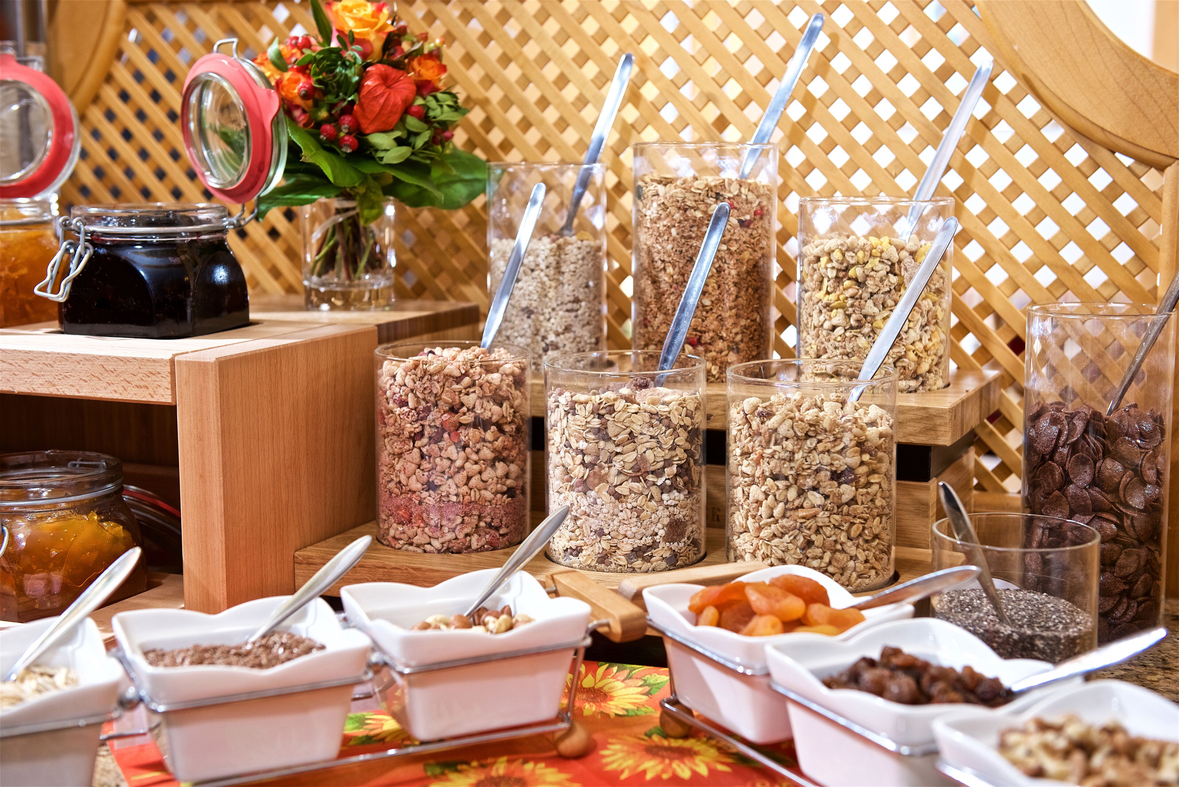 A buffet setup with various food items and utensils.