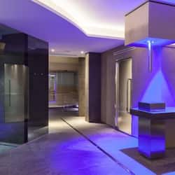 Stylish hallway leads to a contemporary kitchen with sleek appliances and minimalist design.