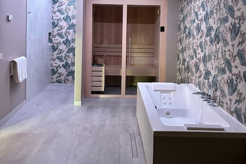 Suite with Private Jacuzzi and Sauna | Minibar, in-room safe, desk, laptop workspace
