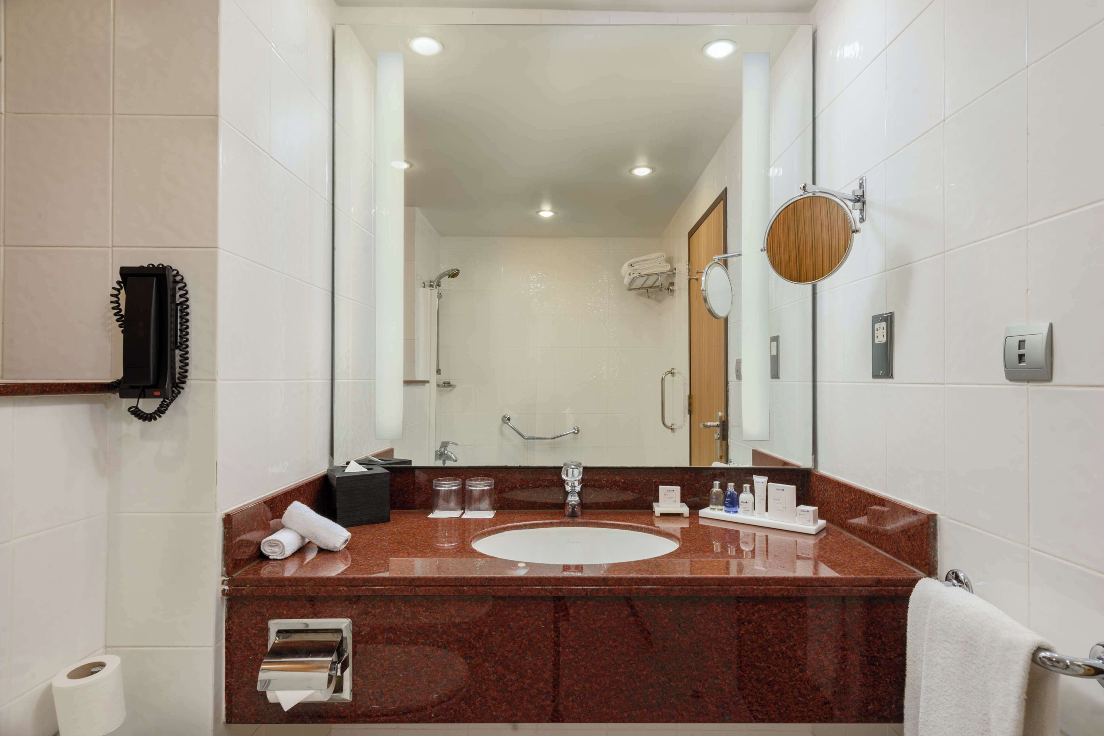 combined shower/bathtub, free toiletries, hair dryer, slippers