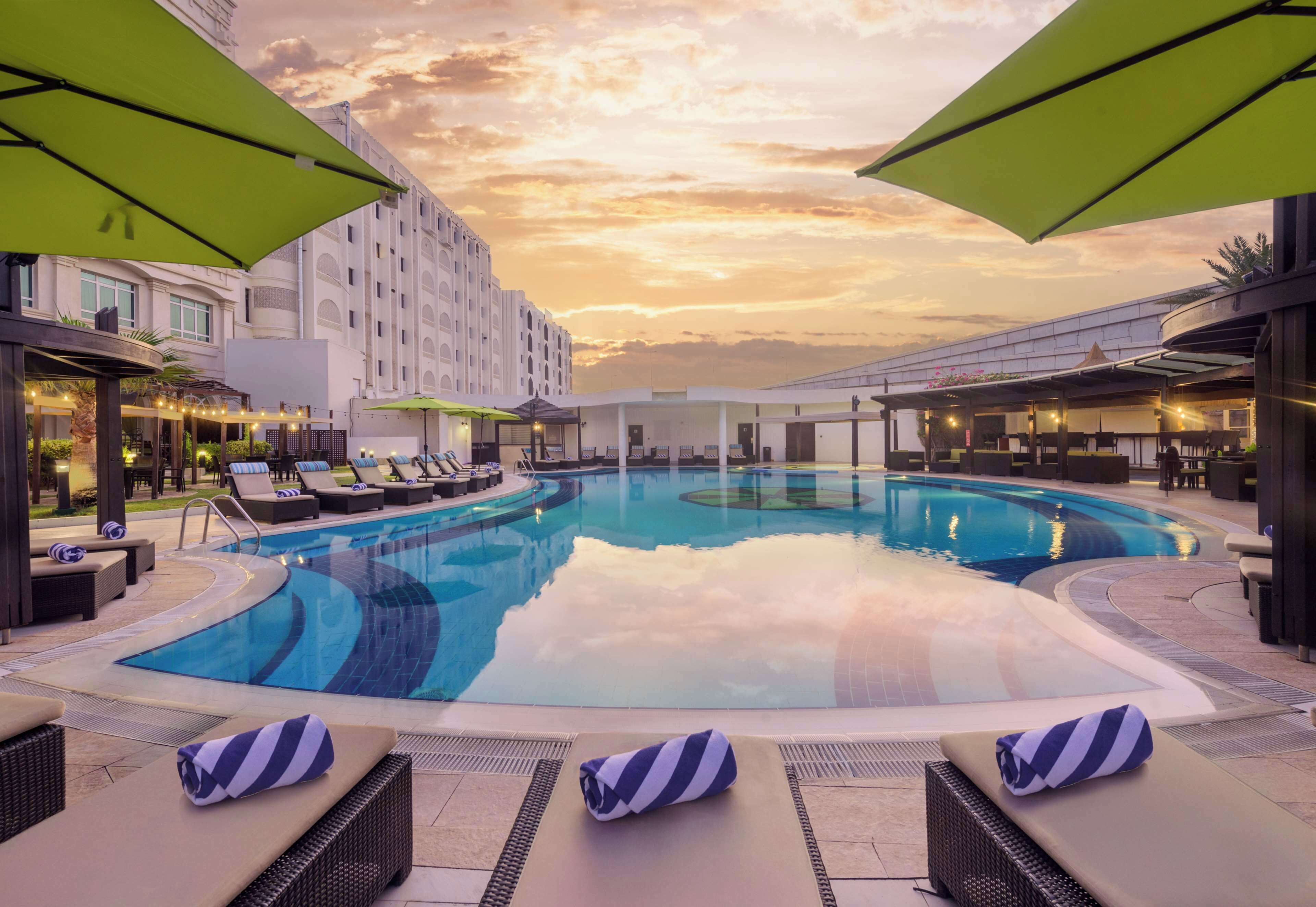 Outdoor pool, pool umbrellas, sun loungers