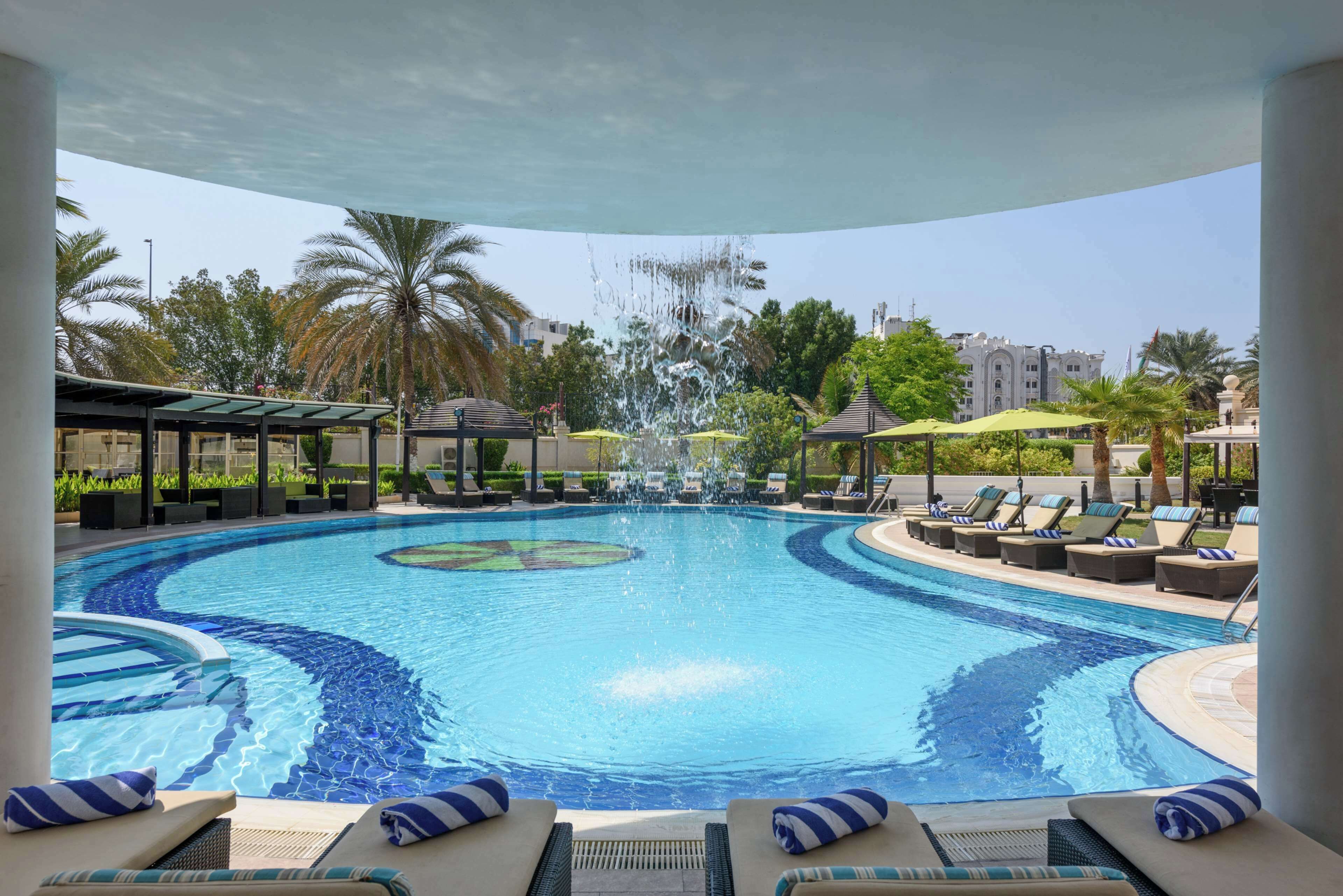 Outdoor pool, pool umbrellas, sun loungers