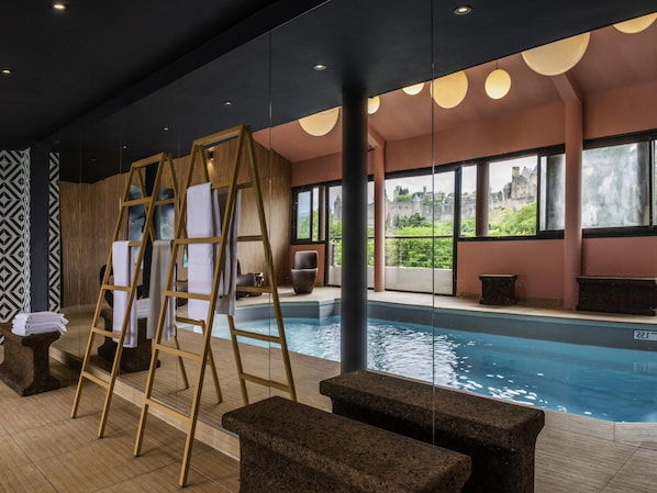 Indoor pool, open 10:00 AM to 9:00 PM, pool loungers