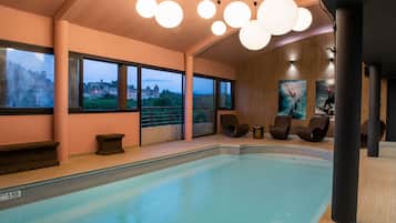 Indoor pool, open 10:00 AM to 9:00 PM, pool loungers