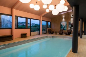 Indoor pool, open 10:00 AM to 9:00 PM, pool loungers