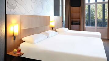 Premium bedding, desk, blackout drapes, soundproofing