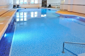 Indoor pool, open 8:00 AM to 6:30 PM, pool loungers