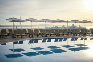 Indoor pool, outdoor pool, pool umbrellas, sun loungers