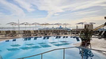 Indoor pool, outdoor pool, pool umbrellas, sun loungers