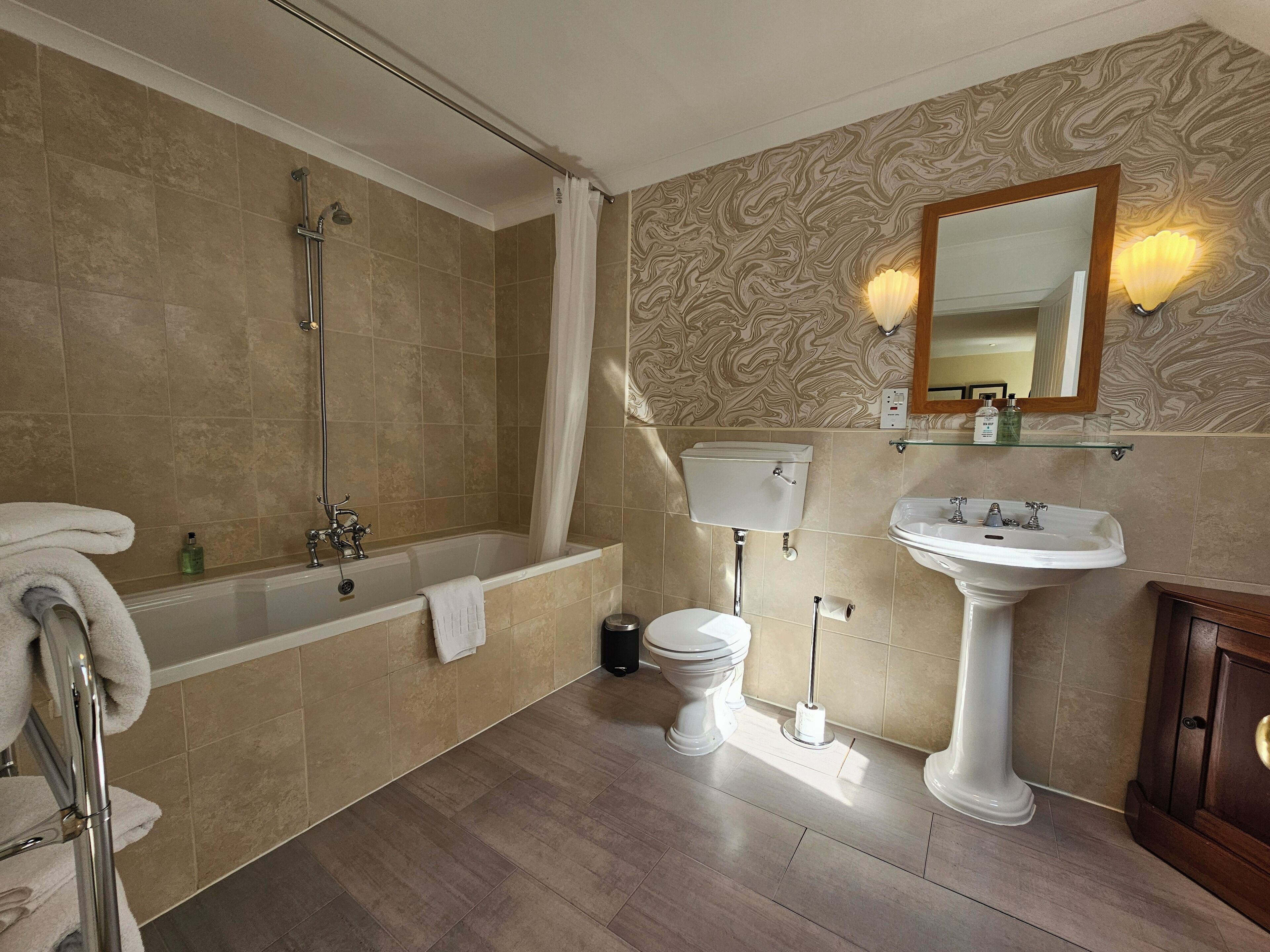 comfy king room | bathroom | hair dryer, towels