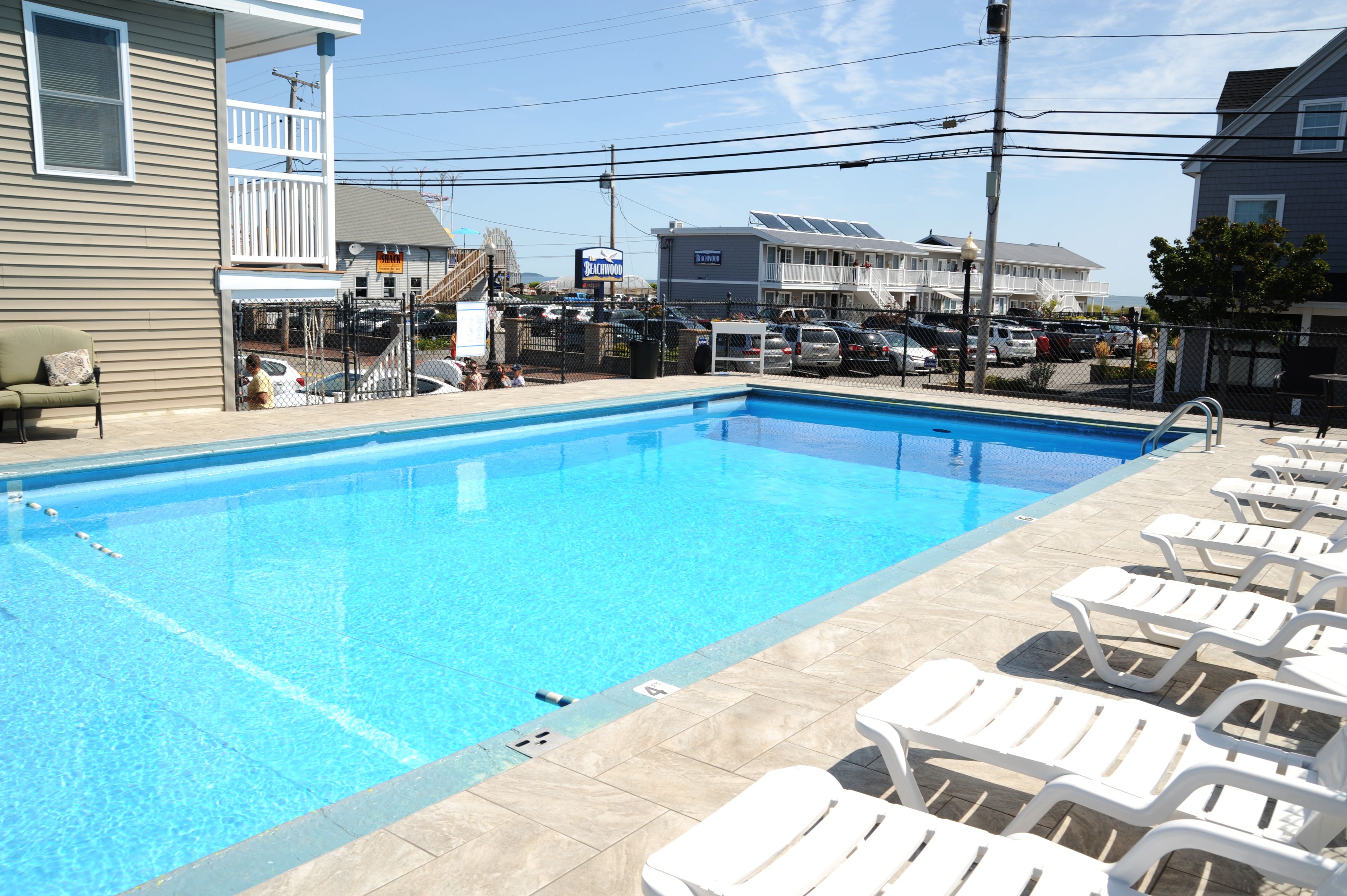 Seasonal outdoor pool, open 9:00 AM to 9:00 PM, pool umbrellas