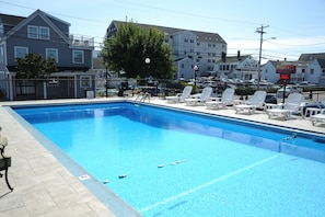 Seasonal outdoor pool, open 9:00 AM to 9:00 PM, pool umbrellas