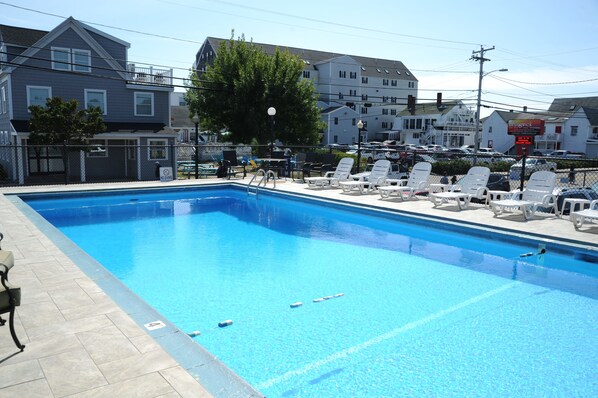 Seasonal outdoor pool, open 9:00 AM to 9:00 PM, pool umbrellas
