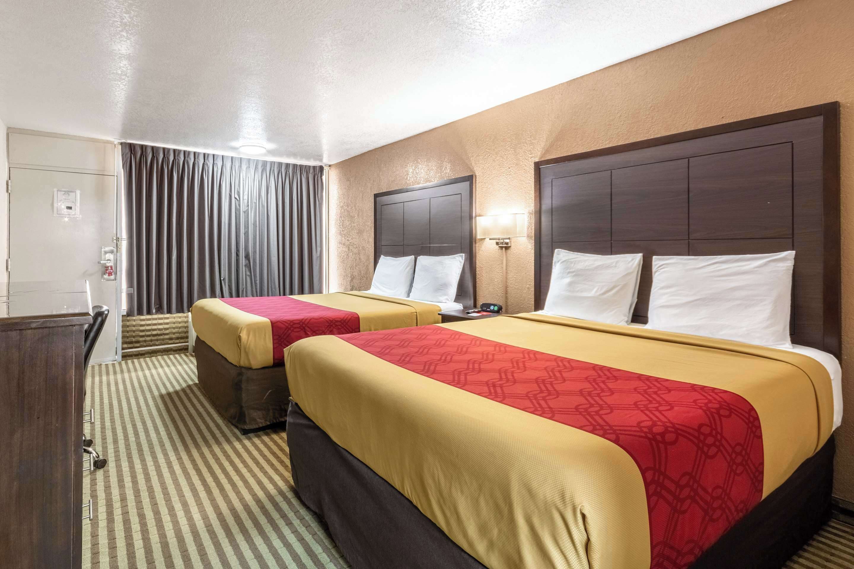 standard room, 2 queen beds, non smoking | pillow-top beds, desk, iron/ironing board, rollaway beds