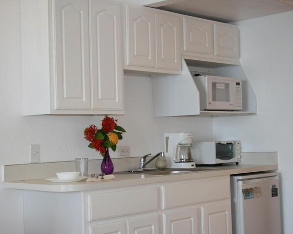 Fridge, microwave, coffee/tea maker, toaster