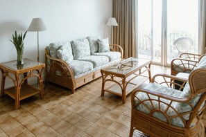 Superior Suite, Partial Ocean View | Living area | Flat-screen TV