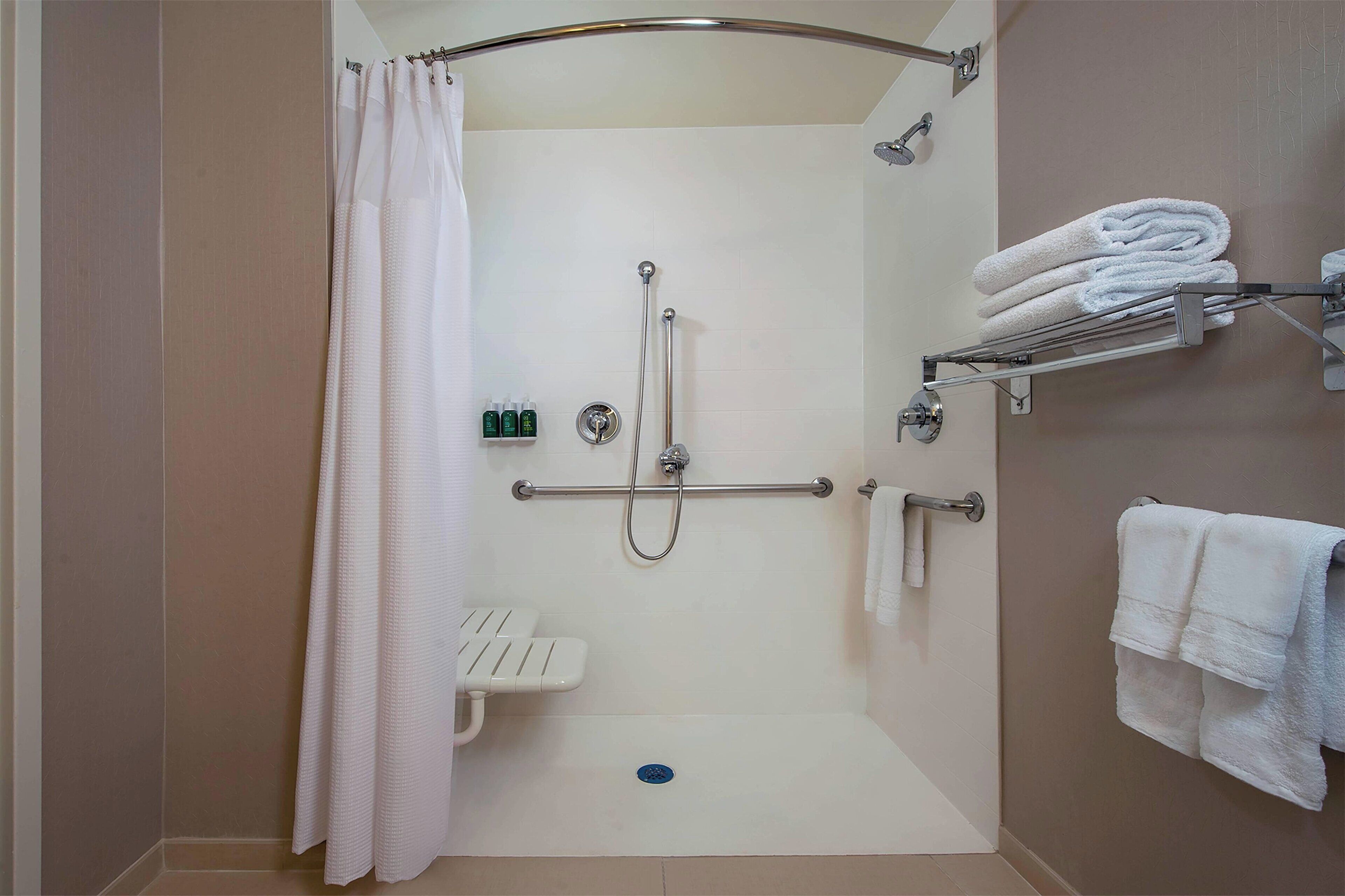 combined shower/bathtub, free toiletries, hair dryer, towels