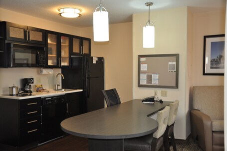 Premium bedding, desk, laptop workspace, blackout drapes