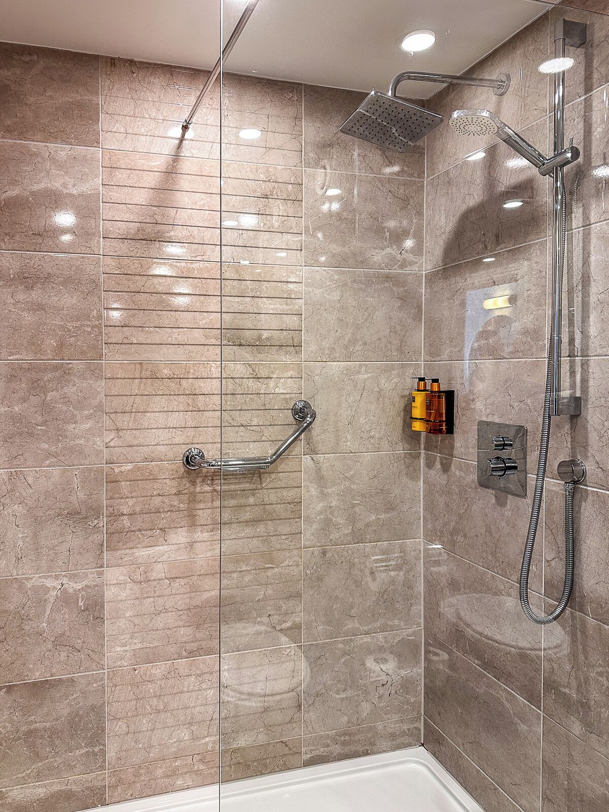 designer toiletries, hair dryer, towels