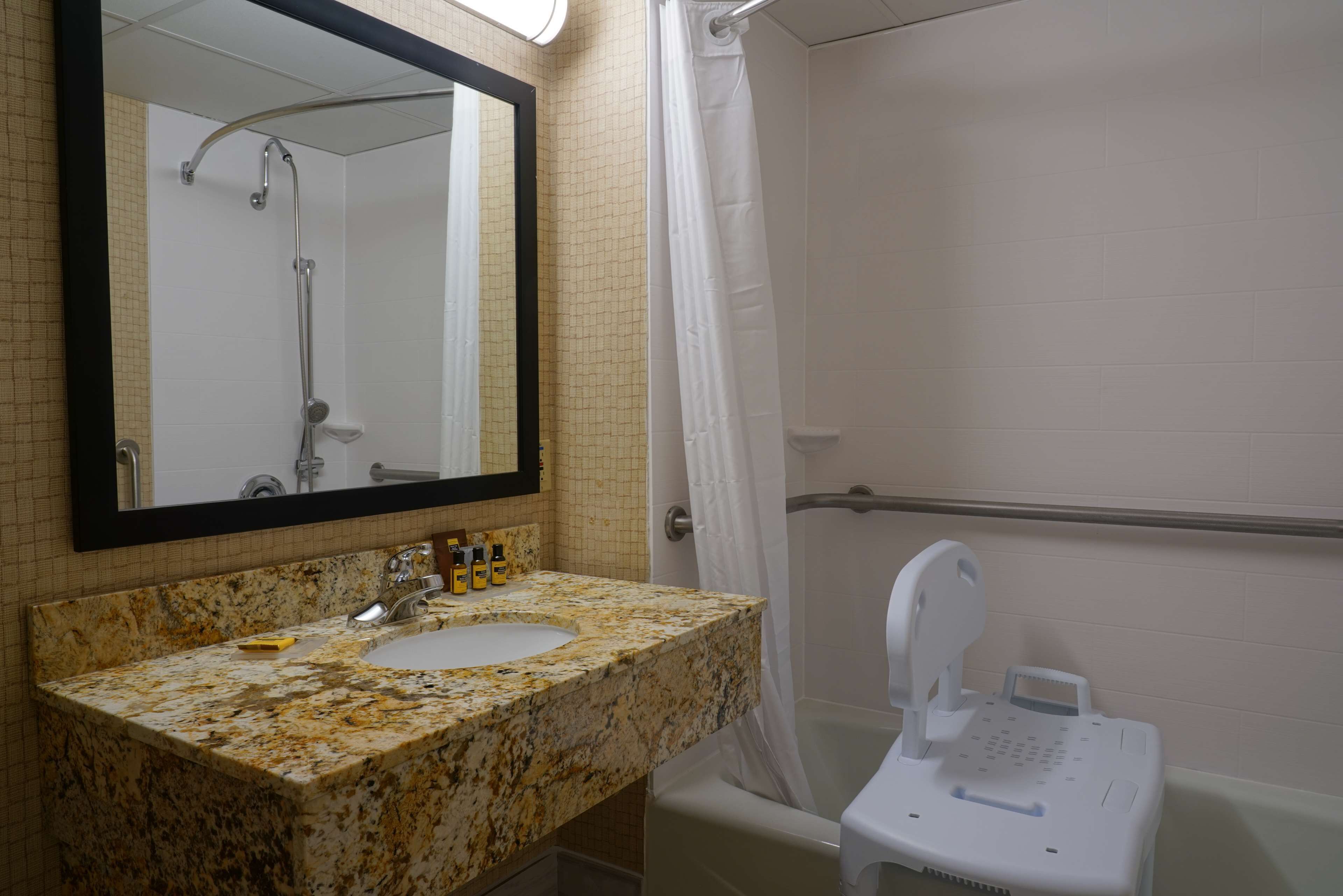 designer toiletries, hair dryer, towels, soap