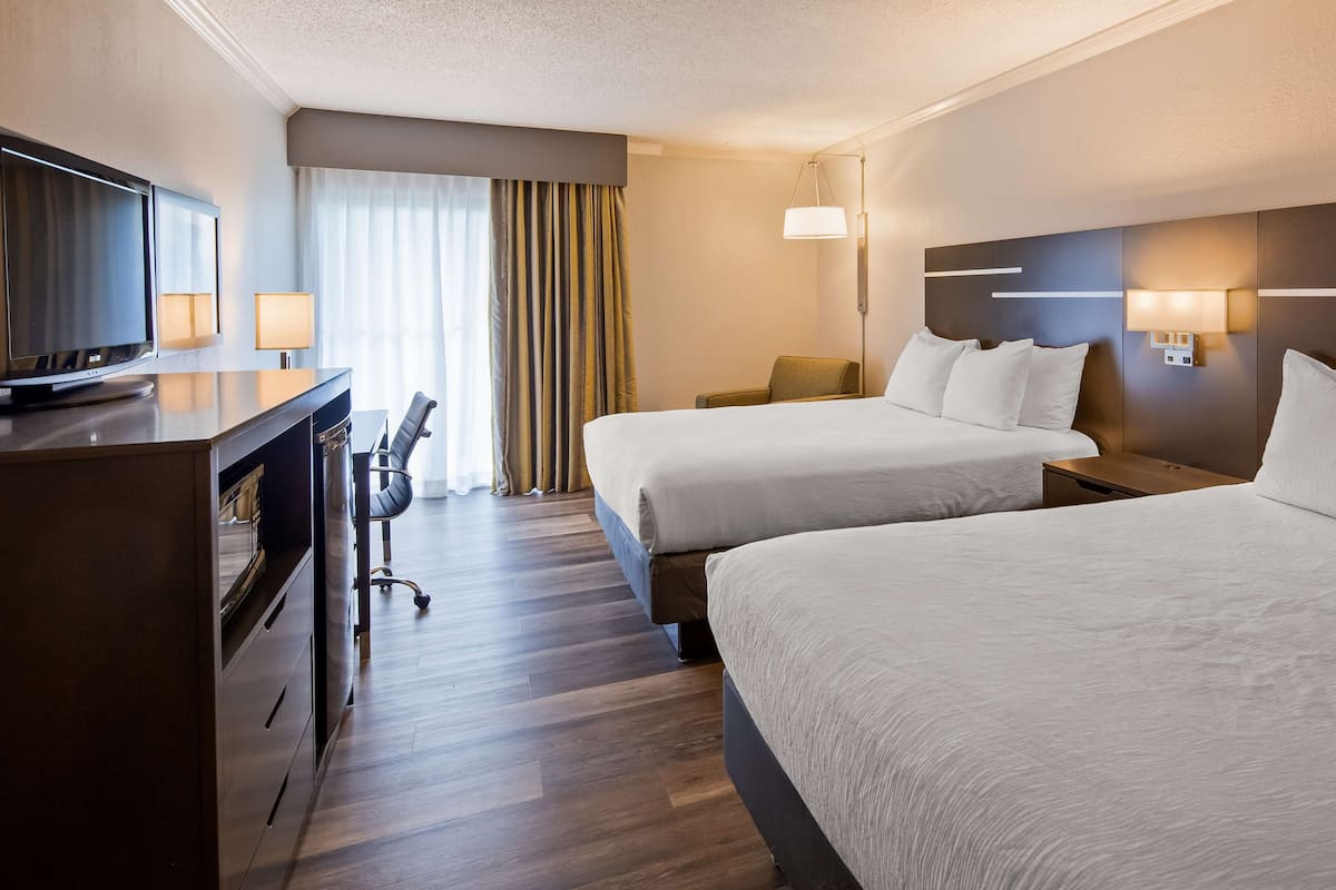 standard room, 2 queen beds, non smoking, refrigerator | in-room safe, blackout curtains, iron/ironing board