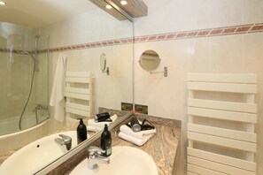 Bathtub, deep soaking tub, eco-friendly toiletries, hair dryer