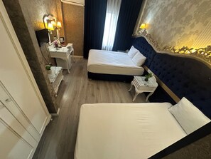 Triple Room | Premium bedding, minibar, in-room safe, desk