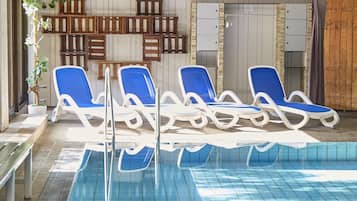 Indoor pool, open 7:00 AM to 10:00 PM, pool loungers
