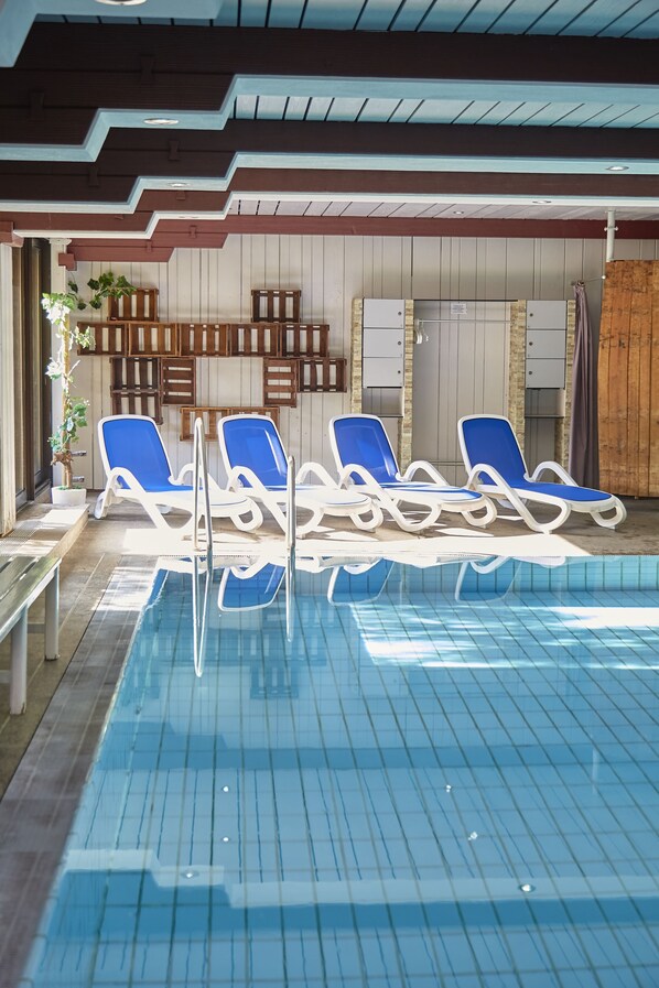 Indoor pool, open 7:00 AM to 10:00 PM, pool loungers