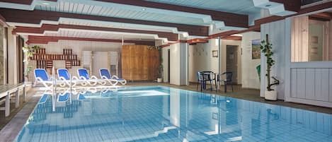 Indoor pool, open 7:00 AM to 10:00 PM, pool loungers