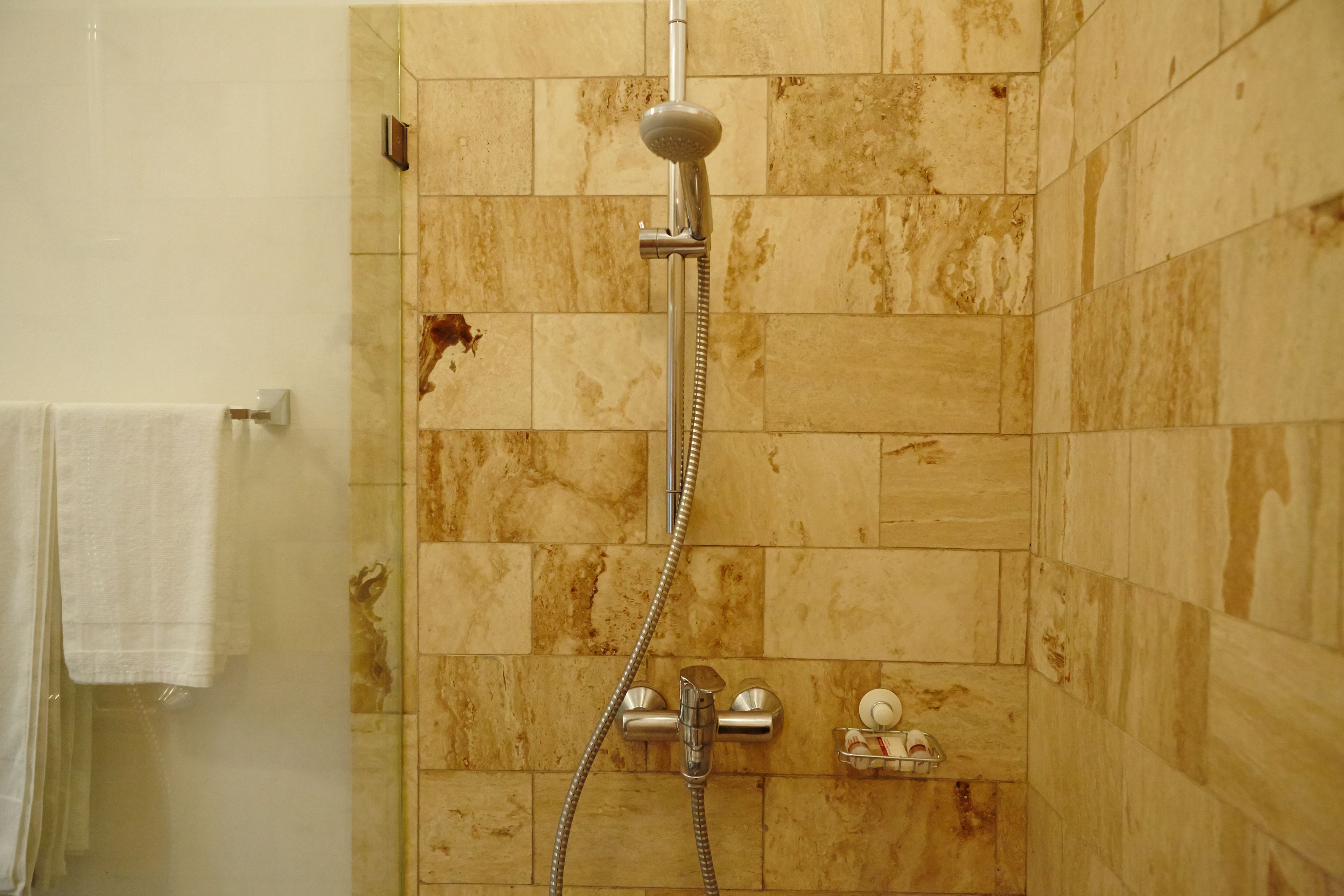 standard room, 1 bedroom, refrigerator, garden view | bathroom shower