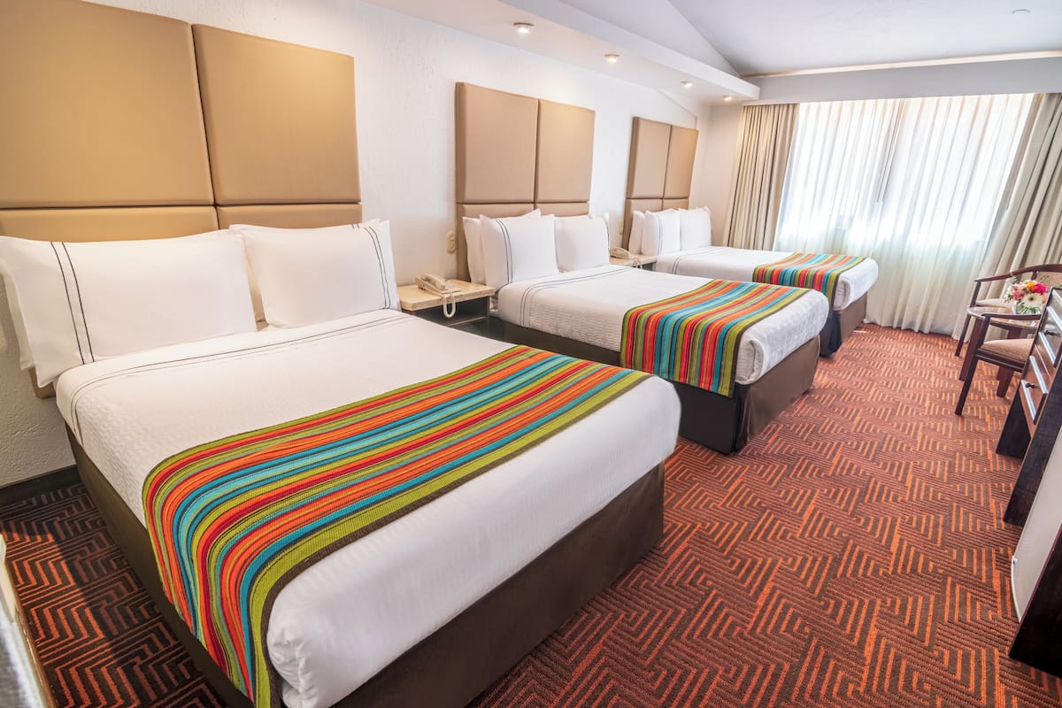 Triple Room, Mountain View | Down comforters, minibar, in-room safe, blackout drapes