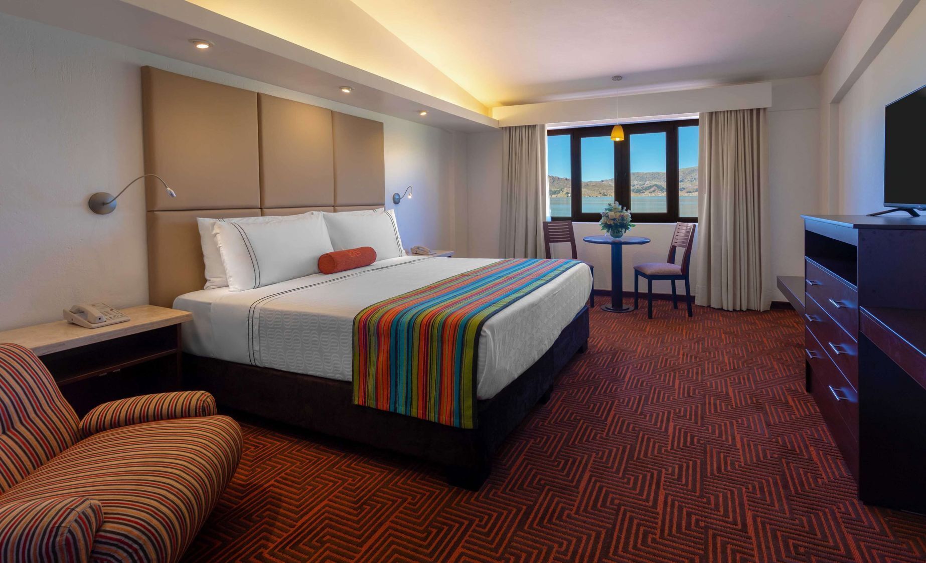 Premium bedding, down comforters, minibar, in-room safe