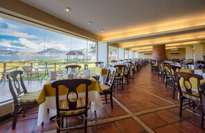 Breakfast, lunch served; local and international cuisine, garden views 