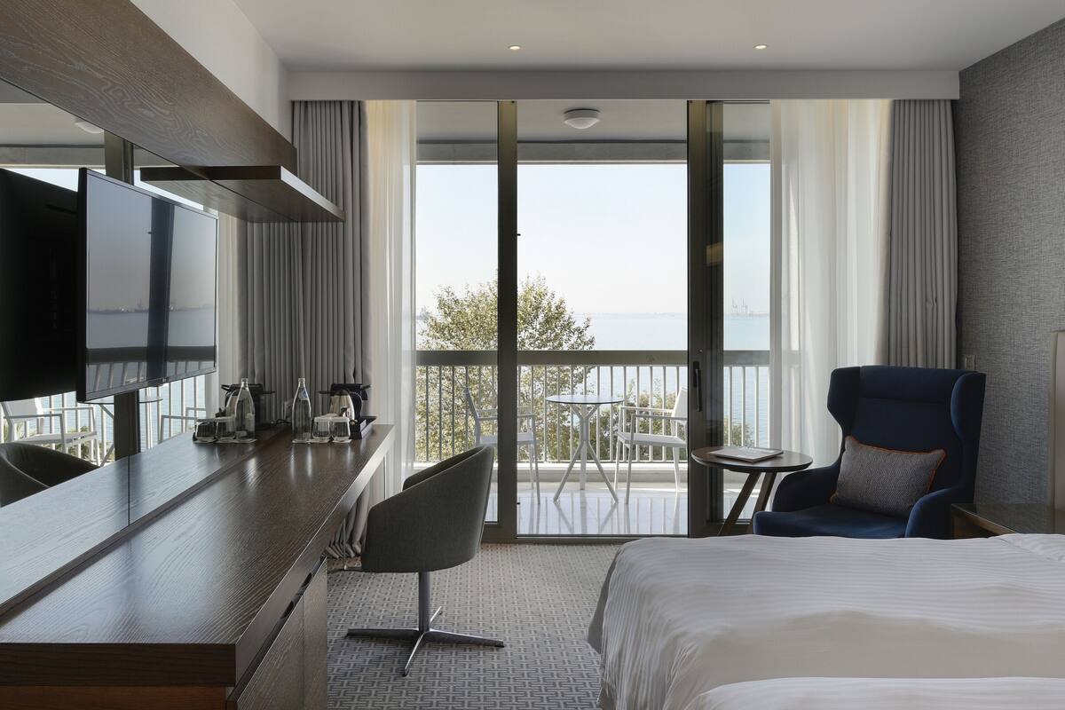 premium room, sea view | premium bedding, in-room safe, desk, blackout curtains