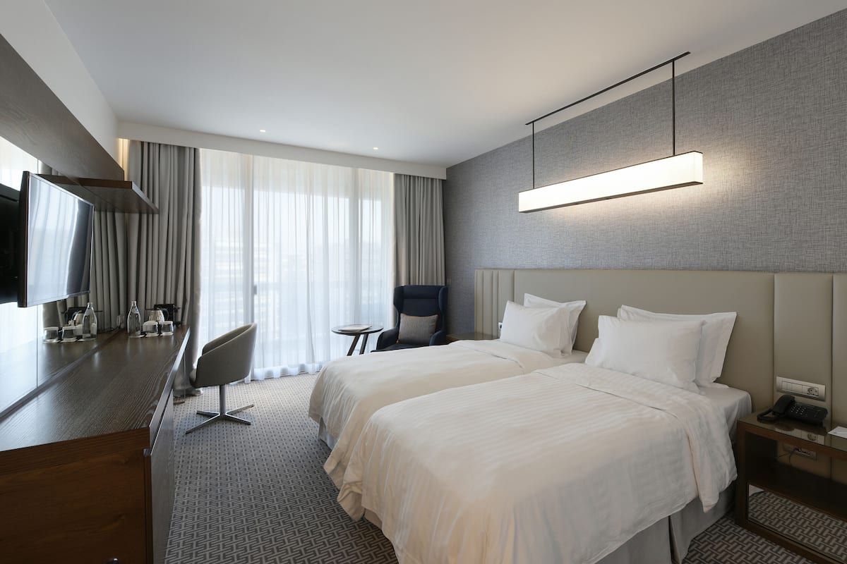 Premium Room, City View | Premium bedding, in-room safe, desk, blackout drapes
