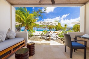 On the beach, white sand, sun-loungers, beach umbrellas