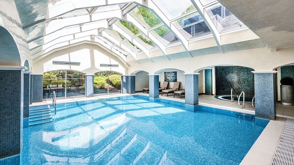 Indoor pool, open 7:00 AM to 7:00 PM, pool loungers