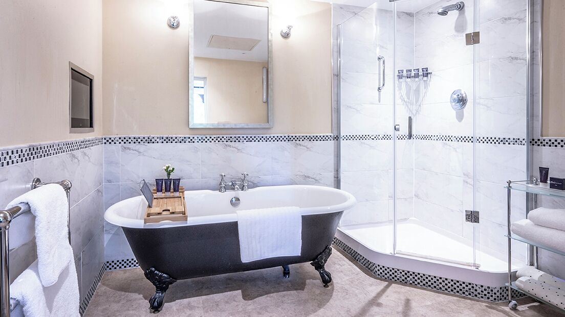 feature room | bathroom | designer toiletries, hair dryer, bathrobes, slippers