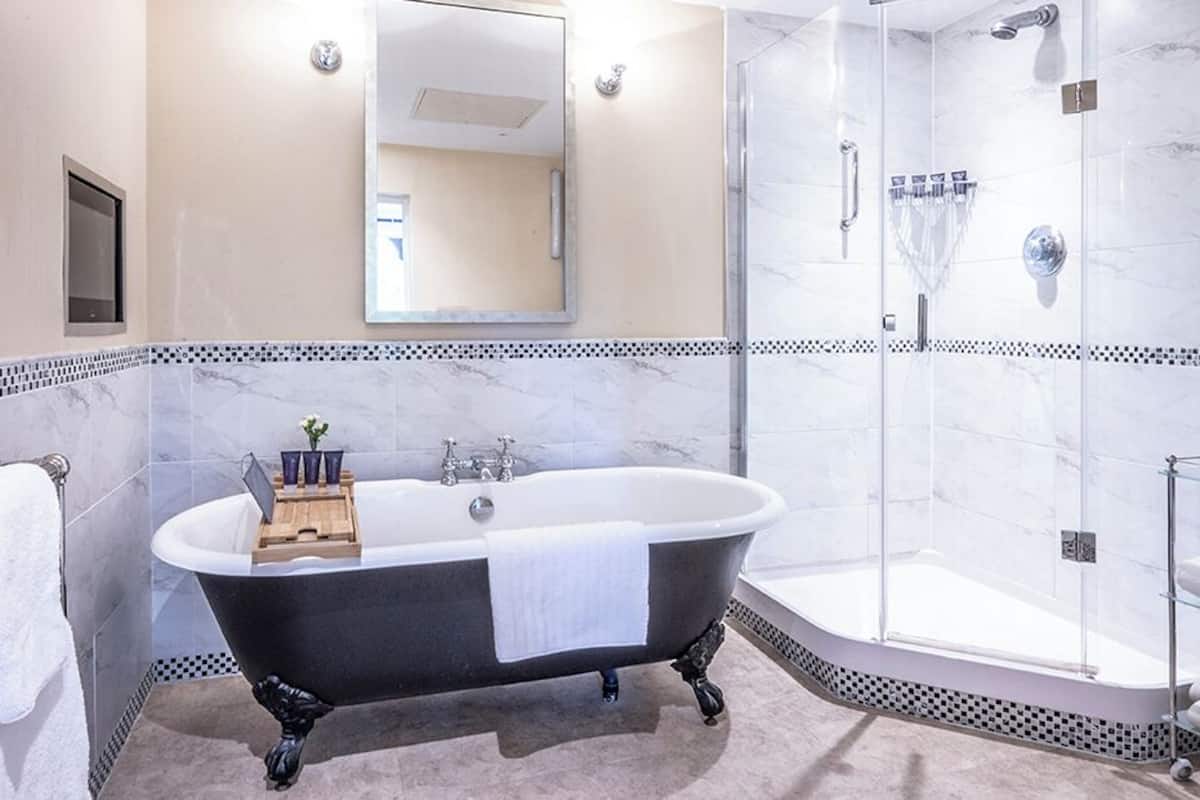 feature room | bathroom | designer toiletries, hair dryer, bathrobes, slippers