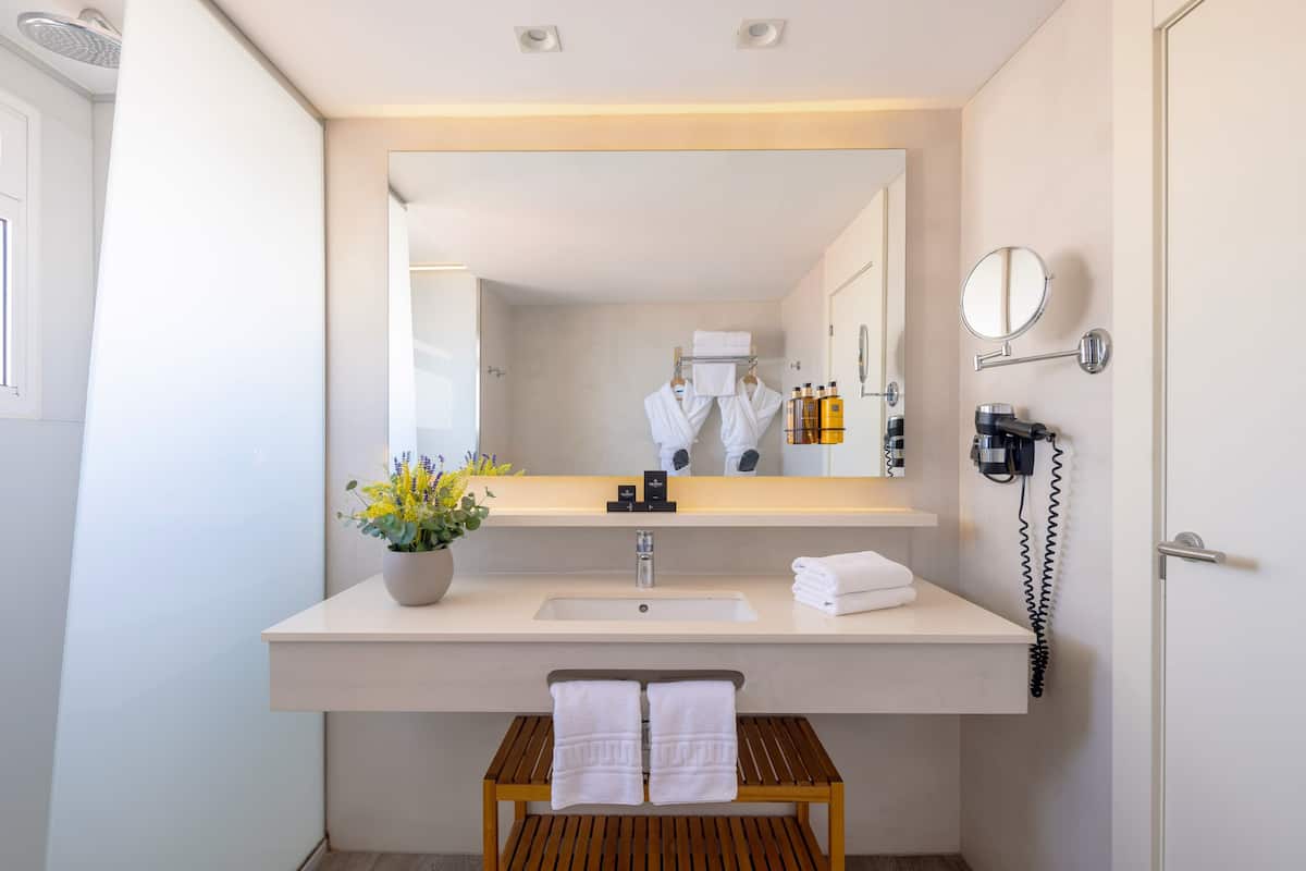 shower, eco-friendly toiletries, hair dryer, slippers