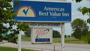 A sign for a suburban Best Value Inn with a high-speed internet advertisement. - Americas Best Value Inn Suburban Motel (Emmetsburg)
