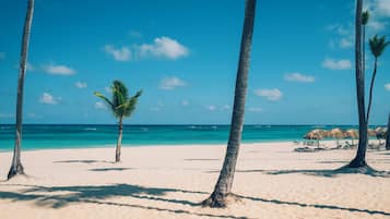 Private beach, white sand, sun loungers, beach umbrellas