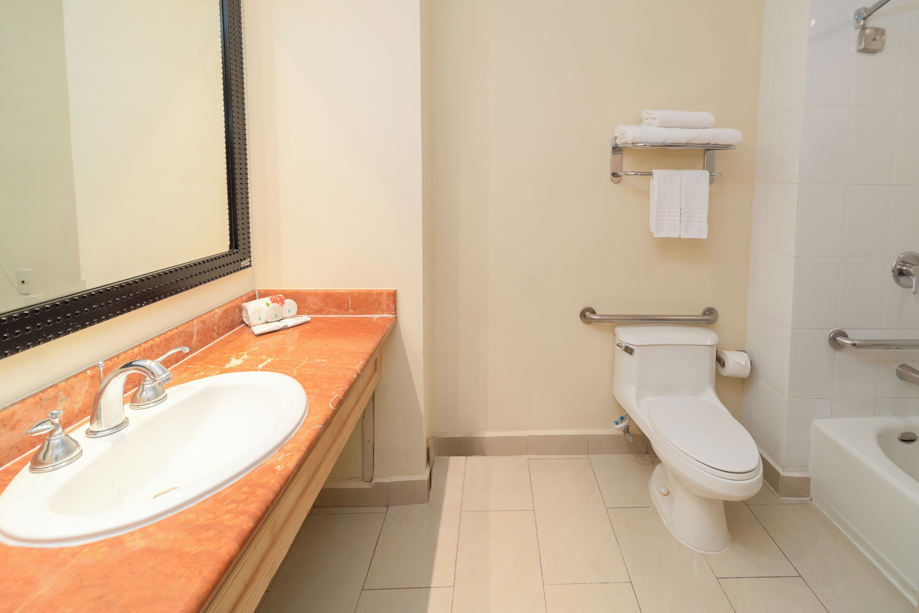 combined shower/bathtub, hair dryer, towels, soap