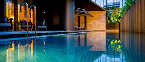 Outdoor pool, open 6:00 AM to 10:00 PM, pool loungers