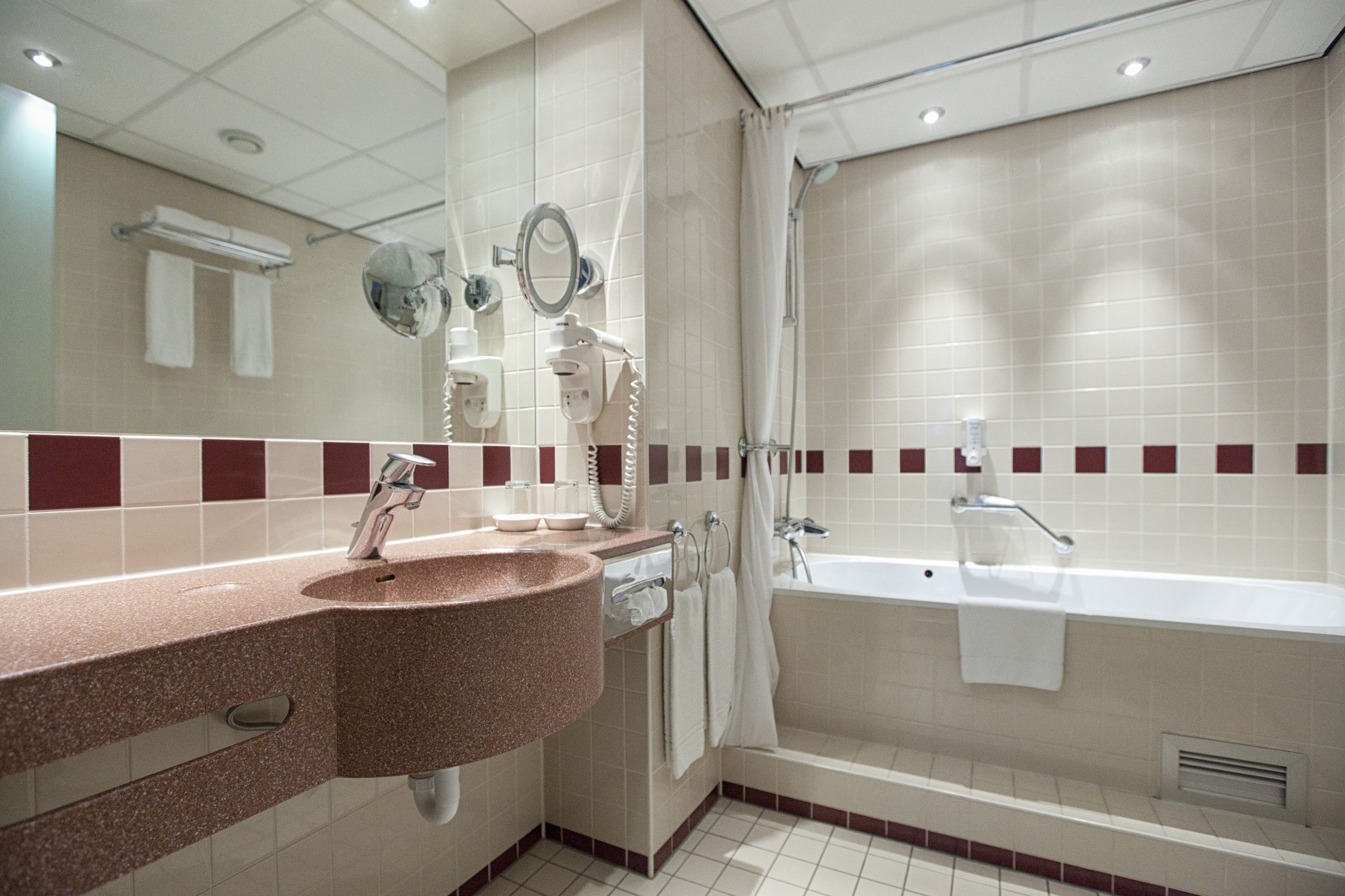 eco-friendly toiletries, hair dryer, towels