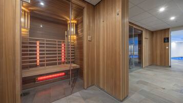 Experience a relaxing retreat with a sauna and comfortable seating area.