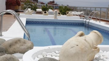 Outdoor pool, pool umbrellas, pool loungers