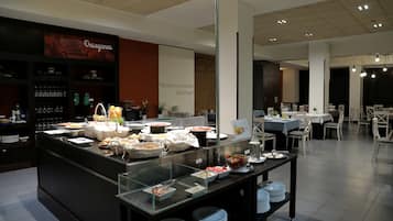 A buffet area with various food items and a glass display case.